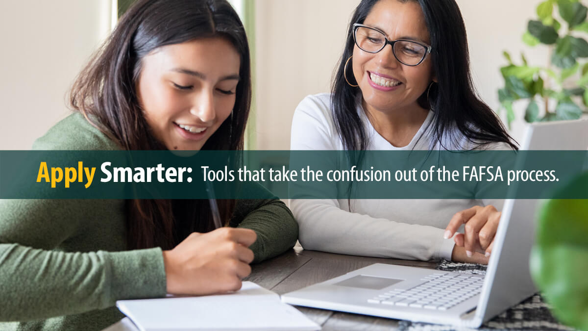 A mother and her teenager using a laptop at home.